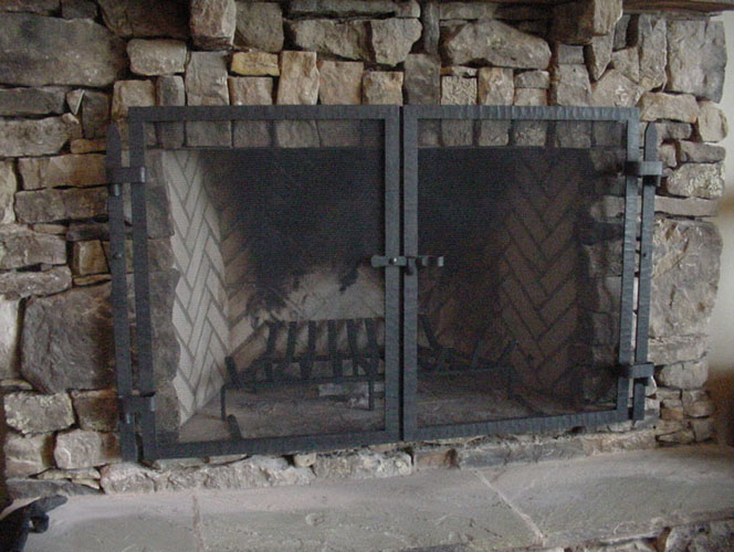 corner fireplace screen, southwestern wrought iron fireplace screen, big sky carvers fireplace screen, fireplace screen new york city